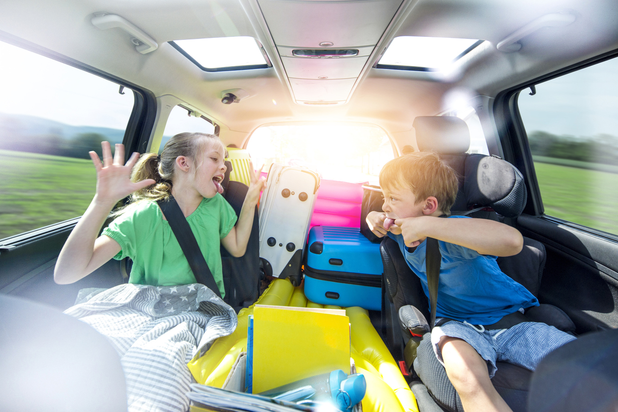 Holidays - Siblings arguing in the car during a long car journey