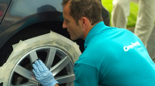 A chipsaway franchisee repairing an alloy wheel
