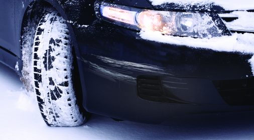 car scratch on a car front, car has snow on it