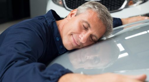 someone lying on a car bonnet