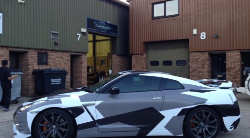 grey, black and white wrap on car