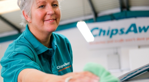 franchisee cleaning a car