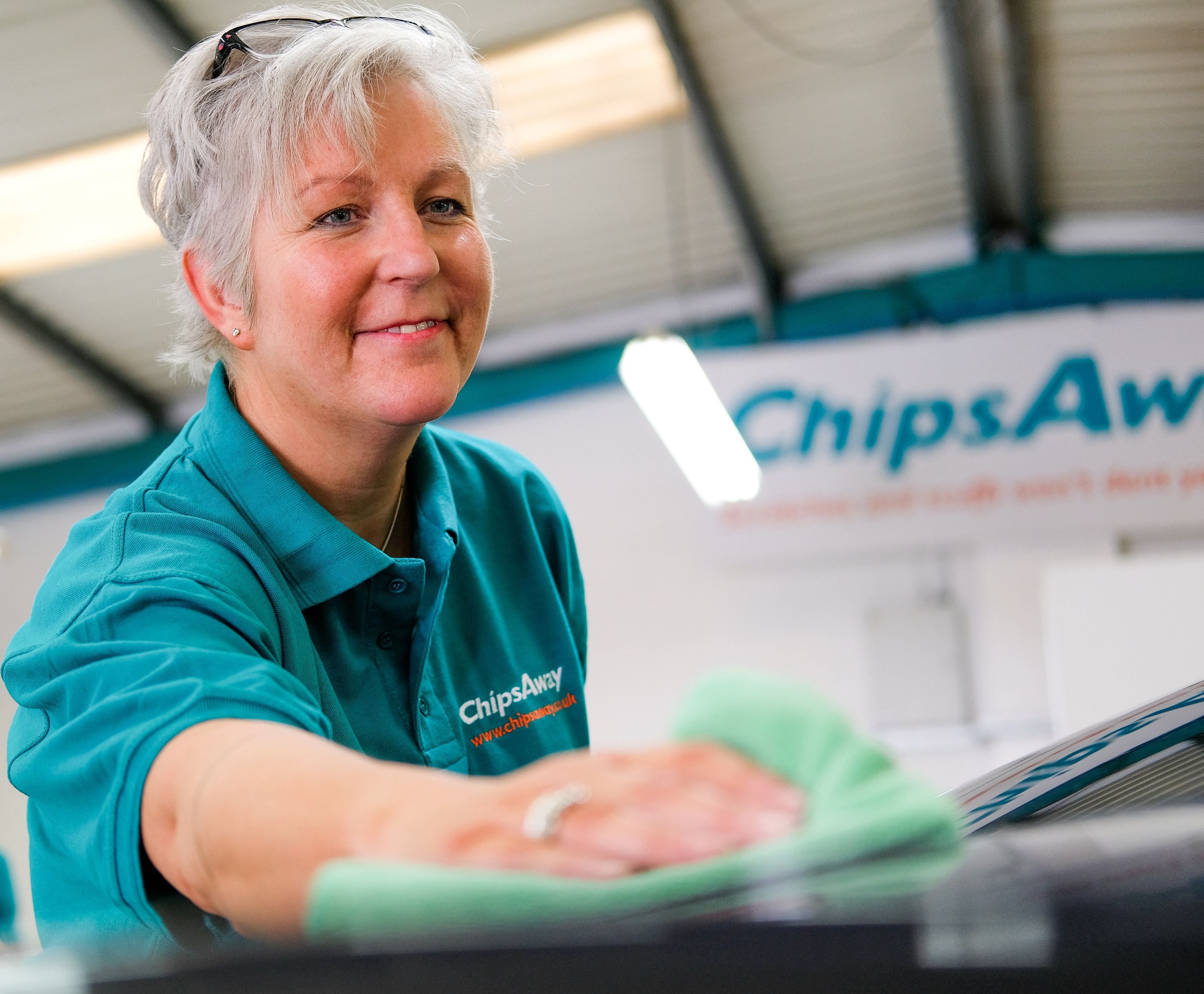 franchisee cleaning a car