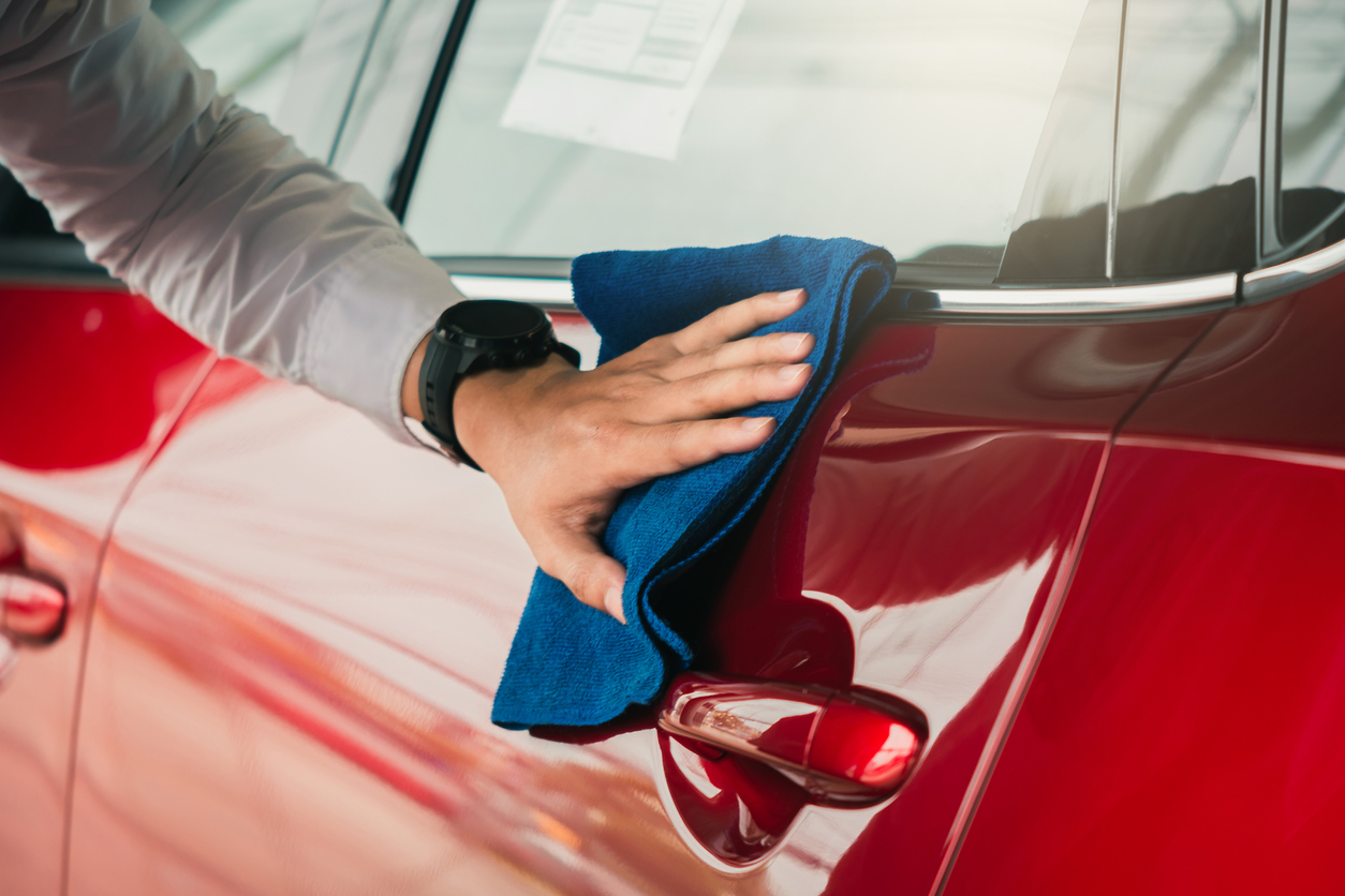 Man inspection and cleaning Equipment car wash With red car For cleaning to quality to customer on car showroom of service transport automobile transportation automotive image.