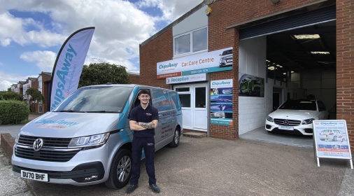 ChipsAway Specialist Brandon Akerman standing in front of van outside Exeter Car Care Centre