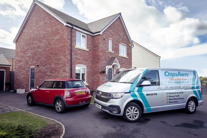 chipsaway van with red car outside house