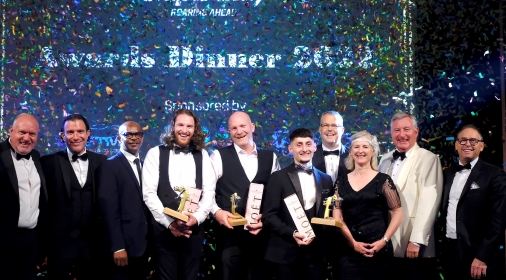 Group of ChipsAway Franchisees with Awards and confetti at black tie event