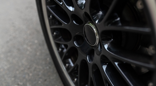 Close-up of a black glossy car alloy wheelrim