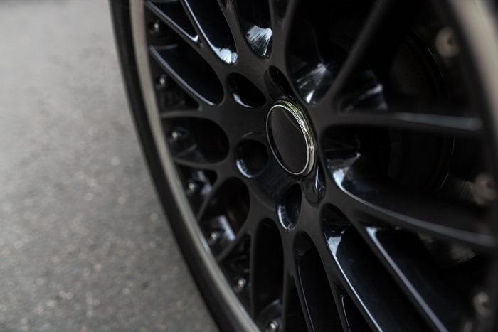 Close-up of a black glossy car alloy wheelrim