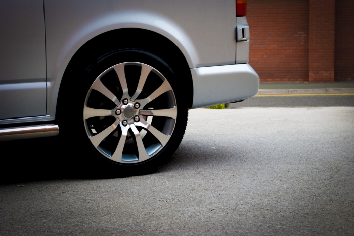 A spectacular 20 inch rim on a cool van. Slight vignetting and some nice, textured copy space.