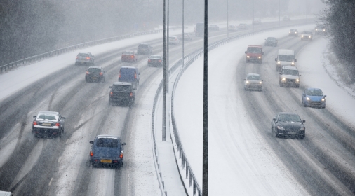 Traffic On Motorway During Snowstorm