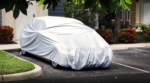 Covered car in residential car park